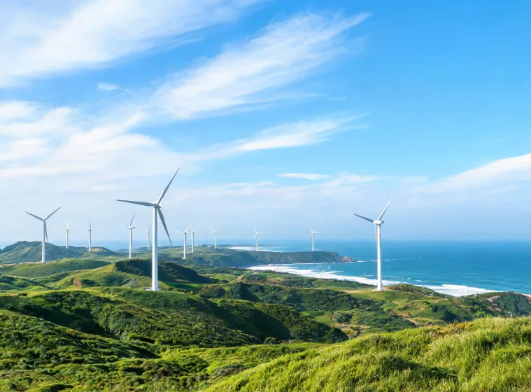 Wind turbines across a coastal renewable energy project